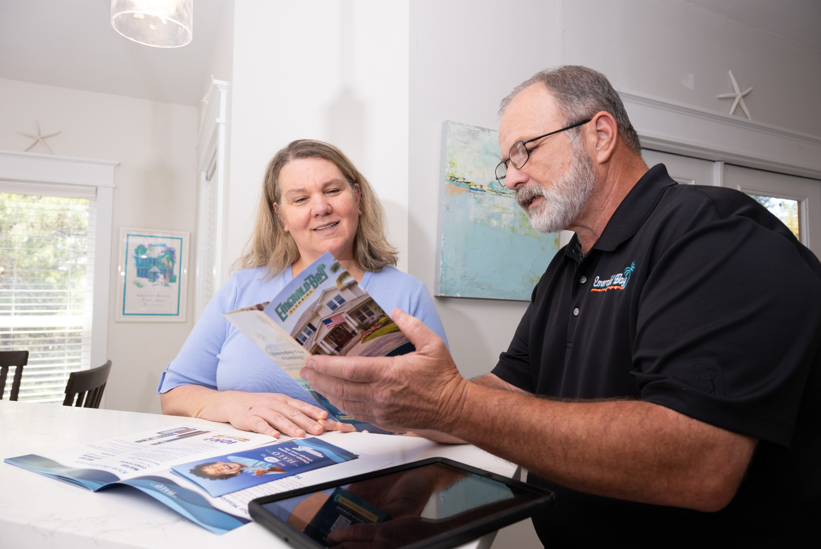 Man and woman discussing financing with GreenSky together